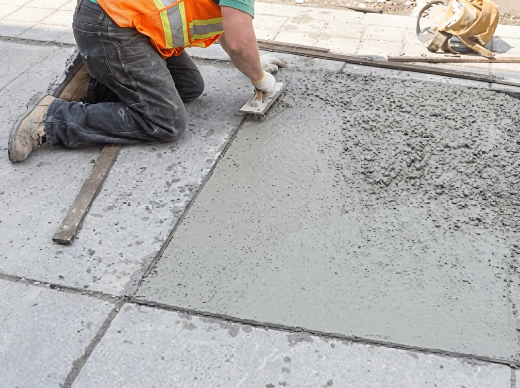 Professional repairing a concrete floor in South Bend, IN